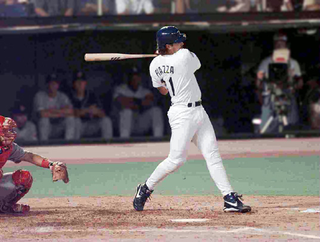 Los Angeles Dodgers catcher Mike Piazza swings and misses for the 31st time during a ninth-inning playoff at-bat last October. Under the new rule, Piazza would have been called out after the third strike.